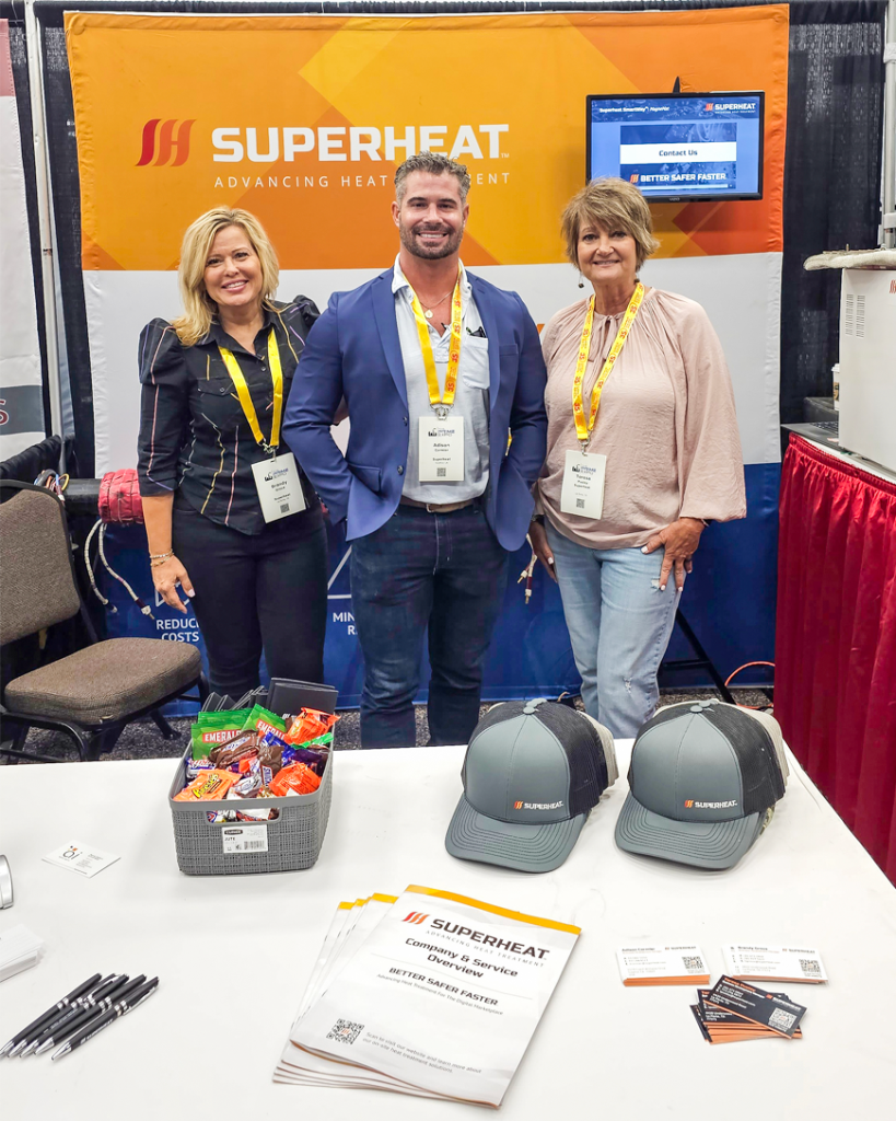 Superheat team members Brandy Groux, Adison Cormier, and Teresa Pusley explaining our on-site heat treatment services.