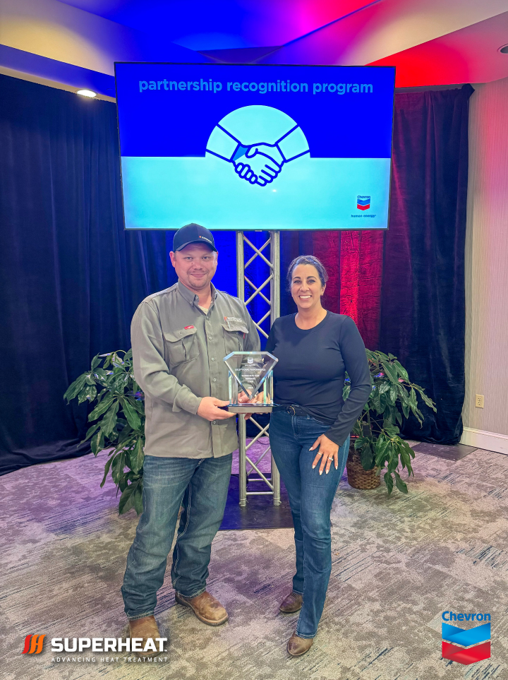 Allen Waits and Angelle Jeansonne accepting the 2024 Exceptional Performance Award from Chevron.
